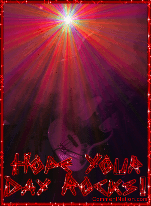 Click to get the codes for this image. This glitter graphic features a guitar player on a dark stage with a bright glittered spotlight in the background. The comment reads: Hope Your Day Rocks!